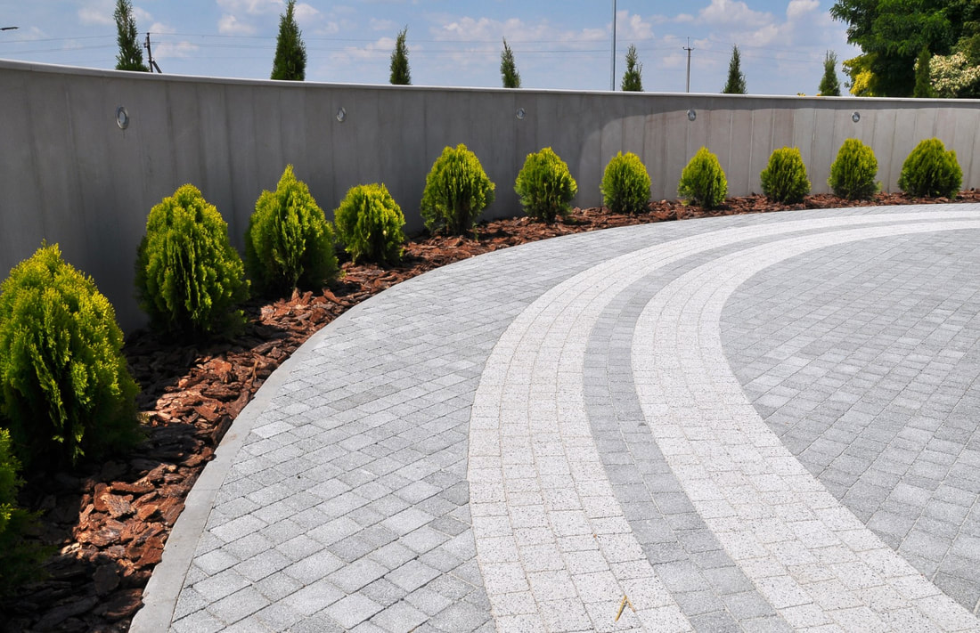 An image of a curved concrete driveway design
