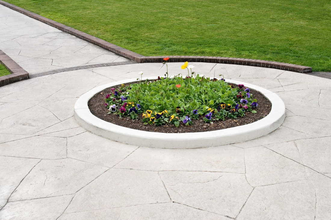 A picture of a round stamped concrete design